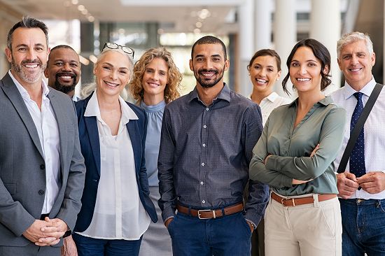 A corporate photo with everyone in business clothing.